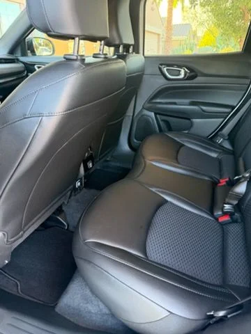 Rear seat of an SUV with leather and cloth upholstery
