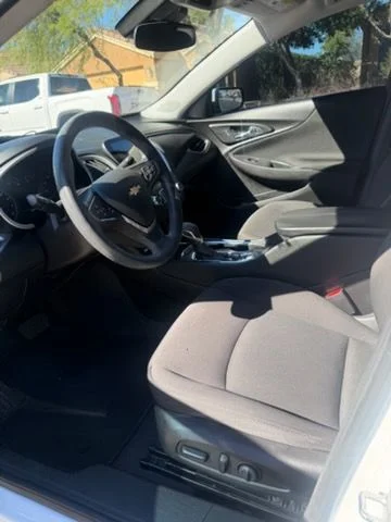 Sedan front seat and steering wheel